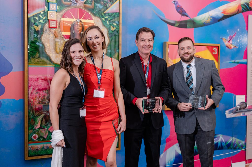 Kim, Quinn, George, and Devon posing for the personal connections award