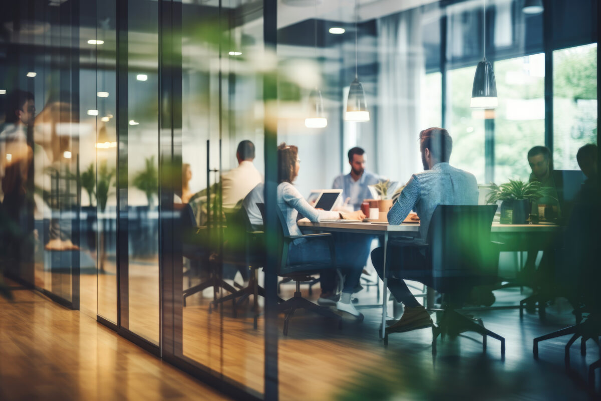 Business office with blurred people